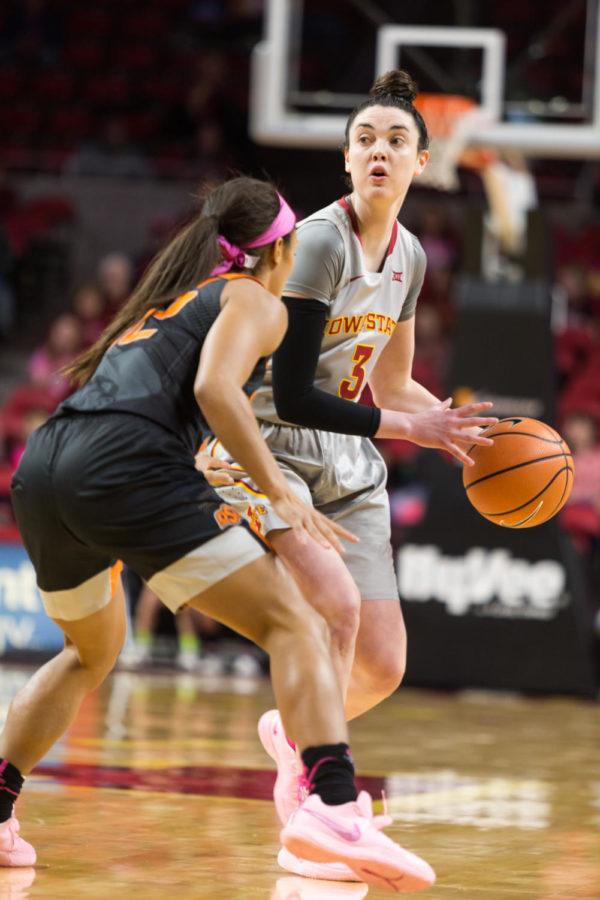 Senior Guard Emily Durr looks for an open pass during the Iowa State vs OSU basketball game Feb. 10 in Hilton Coliseum.The cyclones were narrowly defeated by the Cowgirls 73-81