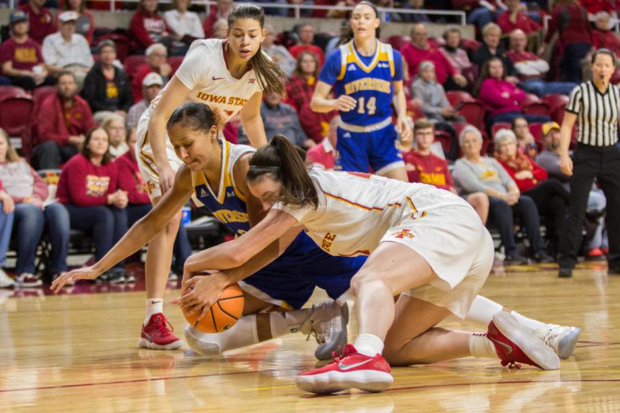 Junior Guard Bridget Carleton scraps for the ball during the Iowa State Vs UC Riverside basketball game Dec 17. The Cyclones Defeated Riverside 89-66