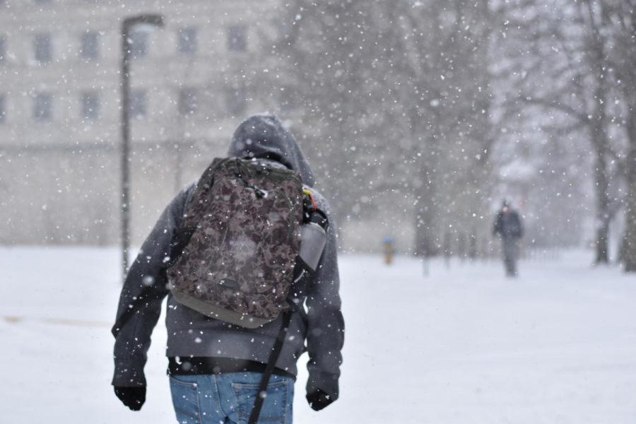 A student braves the blizzard on Monday for their trek to class. 