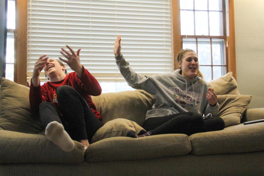 ISU Womens basketball players Bridget Carleton and Claire Ricketts laugh on the couch in their living room after a long practice on Feb. 16.