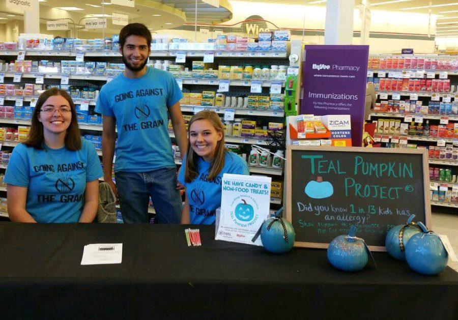 Members of Cys Gluten Free Friends promote the Teal Pumpkin Project inside Hy-Vee, which encourages people to put teal pumpkins on their porch for Halloween to show that they have allergy friendly treats.