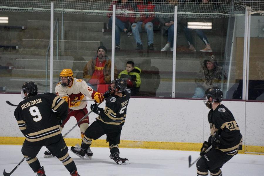 Sophomore Tommy Hanson attempts to push a Lindenwood player away during an attempt to claim the puck, ending with a cringe-worthy photo.The ending score of this game was 0-2, another loss for the cyclones. 