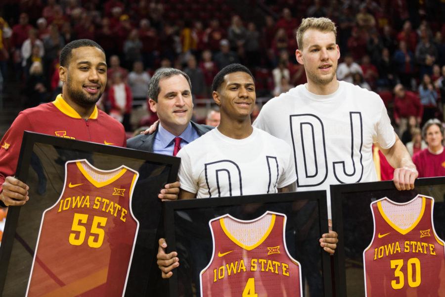 Graduating+seniors+Jeff+Beverly%2C+Donovan+Jackson+and+Hans+Brase+pose+with+head+coach+Steve+Prohm%C2%A0before+the+start+of+the+Iowa+State+vs+Oklahoma+State+senior+night+basketball+game+Feb+27+in+Hilton+coliseum.+OSU+defeated+the+Cyclones+80-71.