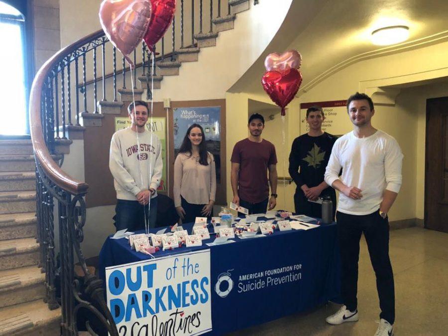 Students, including co-director Scott Moss, and Suicide Awareness Organization president Nathan Pfister table on Feb. 14, 2018 to help spread awareness about the upcoming Out of Darkness walk in March. 