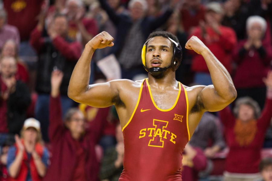 Iowa State Redshirt Freshman Sam Colbray Flexes to the crowd after wrestling Jacob A. Smith during the Iowa State vs West Virginia wrestling meet Jan. 21. The Cyclones Defeated West Virginia 25-16.