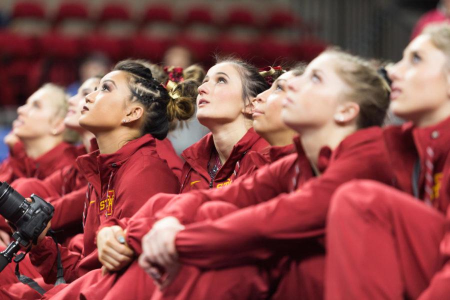 Members of the Iowa State Gymnastics Team watch the seniors highlight video following the Iowa State, Iowa and Missouri tri-meet. the cyclones won with a team score of 196.700 points.  
