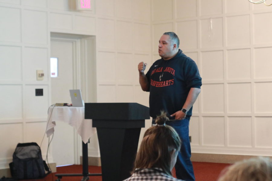 Richard Meyers, president of the Association of Indigenous Anthropologists at Oglala Lakota College in South Dakota, presents his presentation at the American Indian Symposium March 26 in the Cardinal Room at the Memorial Union.
