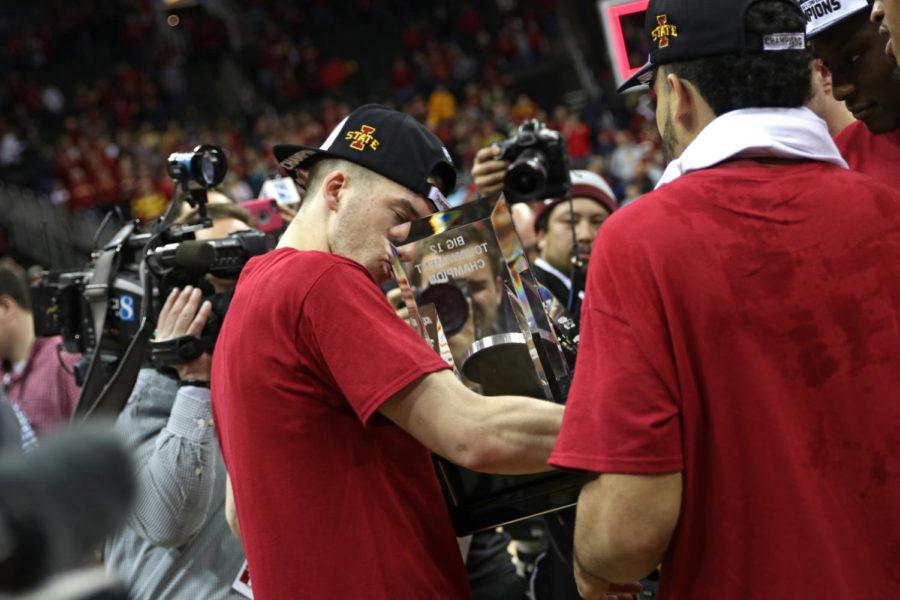 Matt Thomas kisses the Big 12 Championship trophy following the Cyclones 80-74 win over West Virginia in the tournament championship at the Sprint Center in Kansas City, Missouri.
