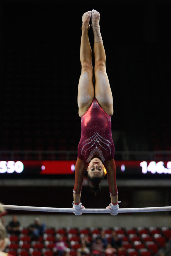 Iowa State junior MJ Johnson competes on the bars at the Big 12 Championships. Johnson scored a 9.125 as the Cyclones finishd in third place.