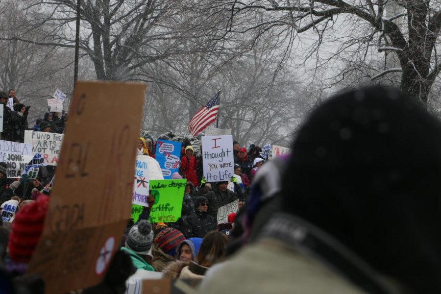 Protestors hold up signs during the March For Our Lives protest on March 24, 2018. Over a thousand people attended the event, which was held at the State Capitol Building in Des Moines.