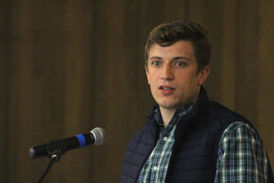 Student Government President Cole Staudt speaks to the student government senate regarding the agenda for the meeting and about cuts in funding to the university in the Campanile Room of the Memorial Union on March 8. 