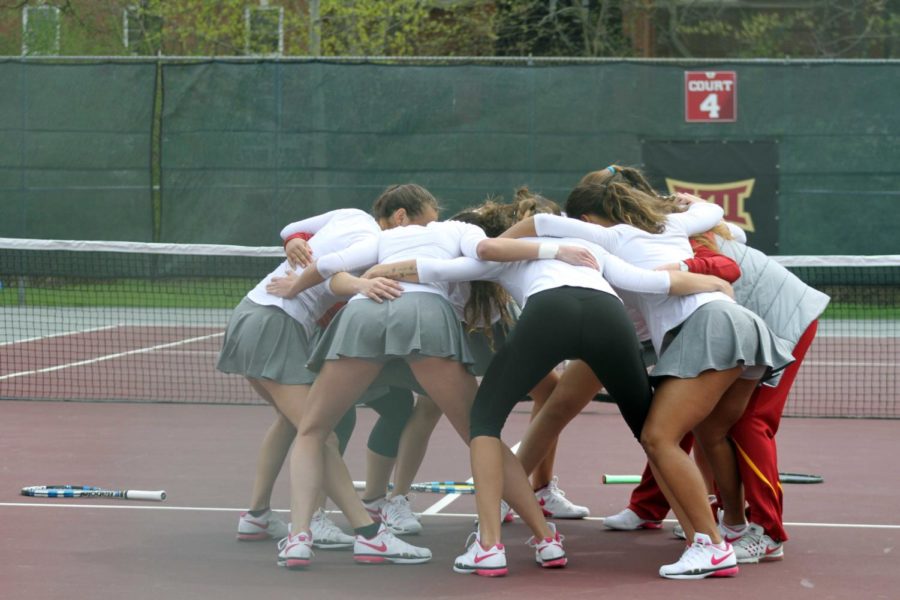 Cyclones huddle together prior to their match against Oklahoma on April 21, at the Forker Tennis Courts.