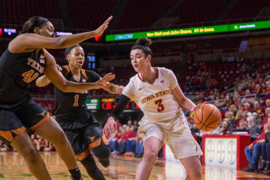 Senior Emily Durr looks for a pass during their game against the University of Texas on Feb. 24 at the Hilton Coliseum. 