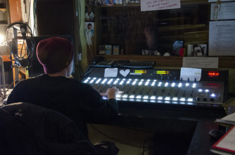 Tanner Vieth, a junior in psychology, DJs during the DM Tea radio show on KURE 88.5 FM.