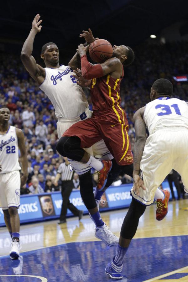Senior guard DeAndre Kane is blocked by Kansass Joel Embiid during Iowa States 92-81 loss to Kansas on Jan. 29 at Allen Fieldhouse. Kane scored 22 points on the night.