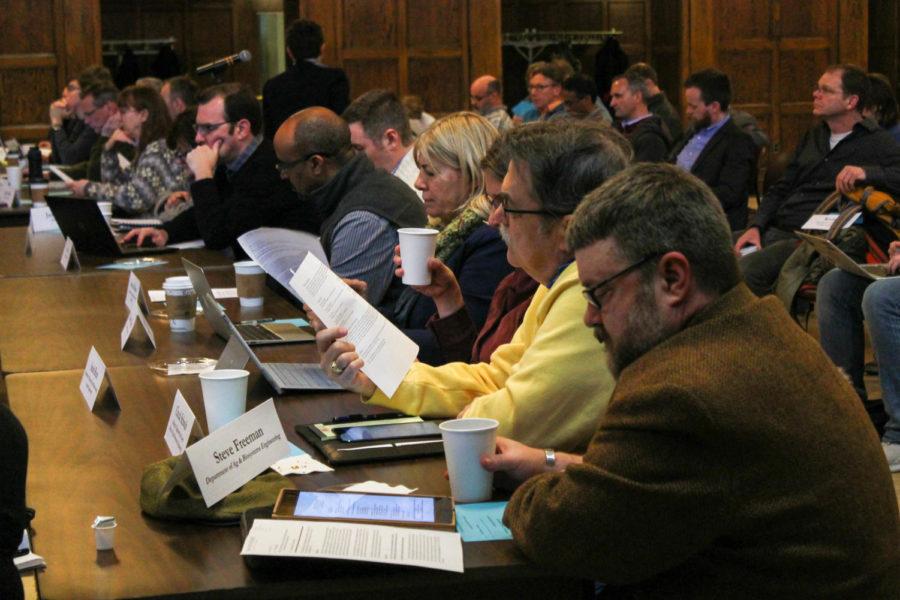 Members of the Faculty Senate listen during a senate meeting on April 3 in the Great Hall at the Memorial Union.