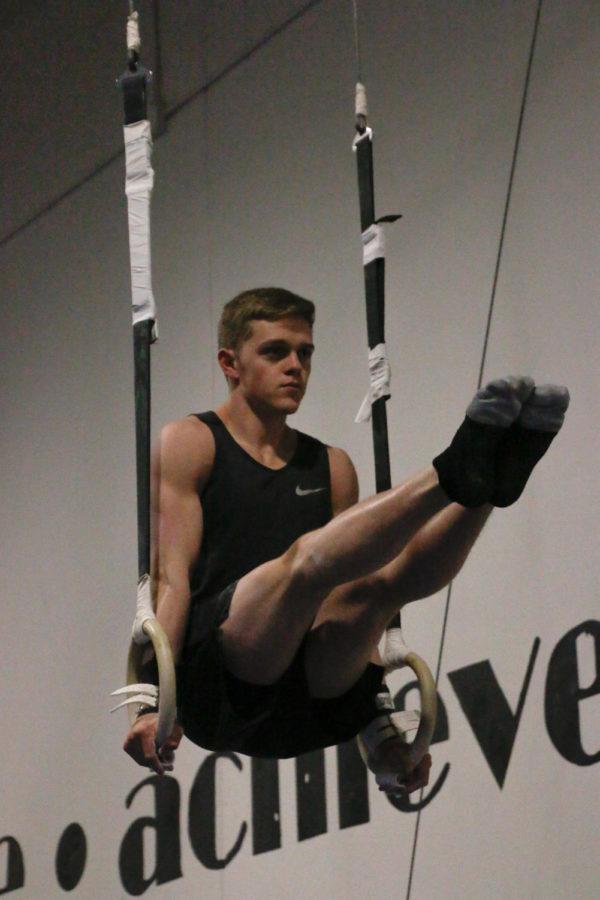 Ben Eyles, an Ames native who is committed to the University of Minnesota for mens gymnastics, balances on the rings at Triad Gymnastics in Ankeny, Iowa. 