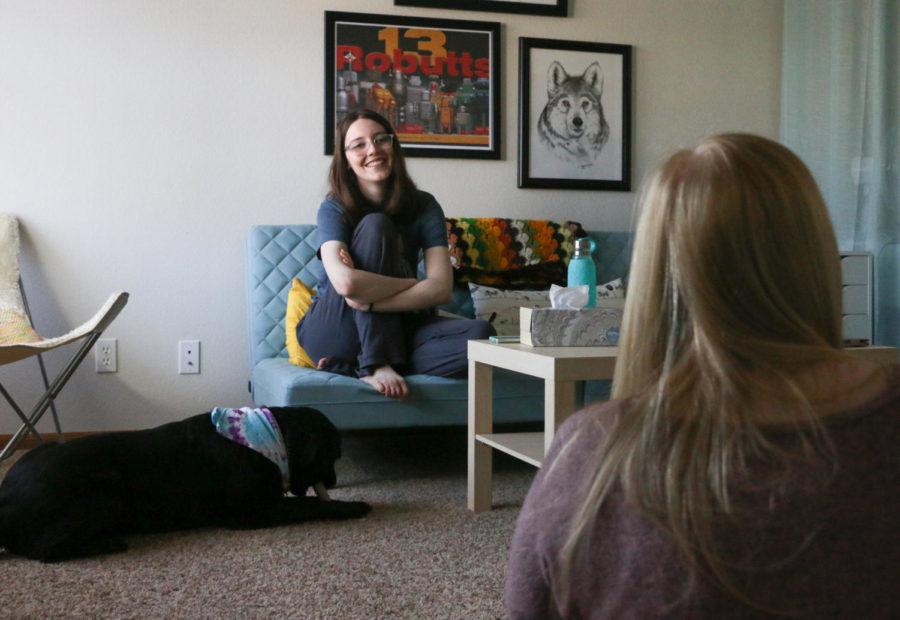 Laura Wiederholt, senior in biology, and Lauren Berglund, junior in child, adult and family services, relax in Wiederholts apartment.