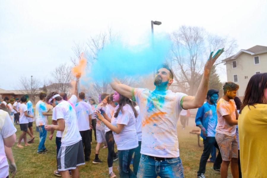 Students throw colored powder at each other during a celebration for the Indian festival of Holi put on by the Indian Students Association on April 21. at the central lawn in Frederiksen Court. 