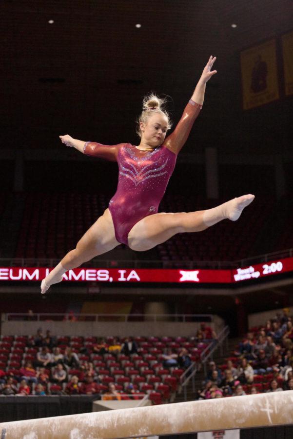 Iowa State Senior Haylee Young leaps into the air during her beam routine. Iowa State took third place in the NCAA Big 12 gymnastics championship with a score of 195.650 over West Virginia at 195.625, but behind Oklahoma at 197.775 and Denver at 197.075. 