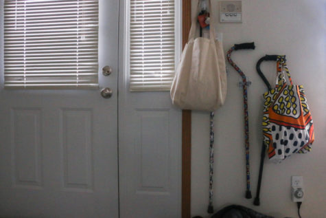 Three canes hang next to the door in Laura Wiederholts apartment. Wiederholt has postural orthostatic tachycardia syndrome, which causes a lack of control in the autonomic nervous system.