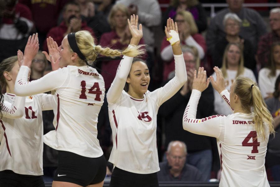 Members of the Iowa State Volleyball team celebrate after winning their first round of the NCAA Volleyball Championship against Princeton University at Hilton Coliseum in Ames, Iowa Dec. 01. The Cyclones defeated the Tigers in three consecutive sets.