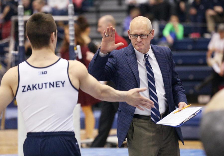 Penn States Sam Zakuteny is congratulated by head coach Randy Jepson on his floor exercise routine against Ohio State on Feb. 11, 2017. The Nittany Lions fell to the Buckeyes 419.150 - 417.750. Photo/Craig Houtz