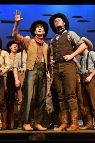 Lincoln Klopfenstein as Will Parker (Left) and Dave Bowles Edwards as Ike Skidmore (Right) gaze off into the distance at the dress rehearsal for Oklahoma on April 3, 2018.