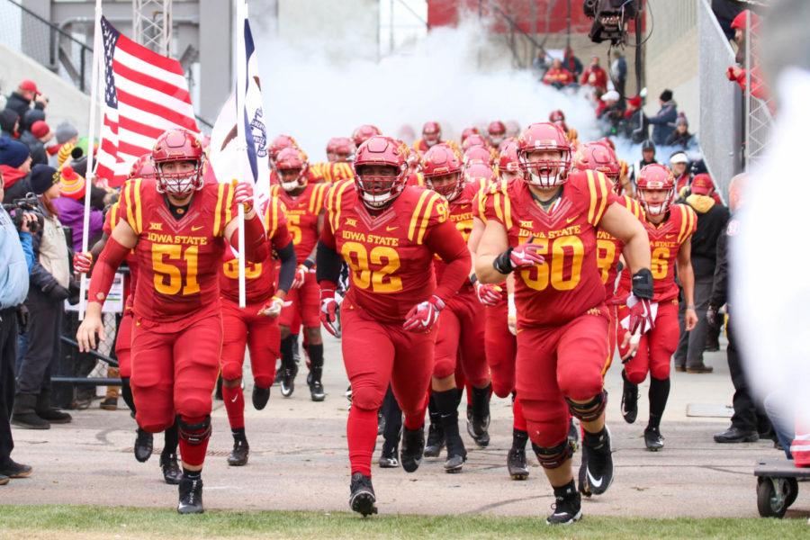 The Iowa State football team sprinting into Jack Trice Stadium before their game against Oklahoma State on Nov. 11.