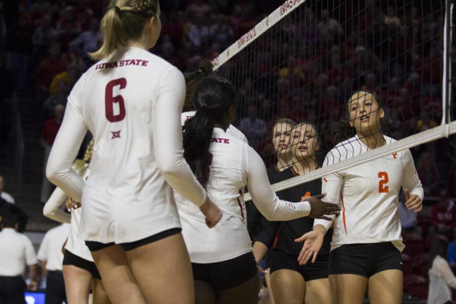 Members of the Iowa State Volleyball team Shake hans with members of the Princeton Volleyball Team before their first round of the NCAA Volleyball Championship at Hilton Coliseum in Ames, Iowa Dec. 01. The Cyclones defeated the Tigers in three consecutive sets. 