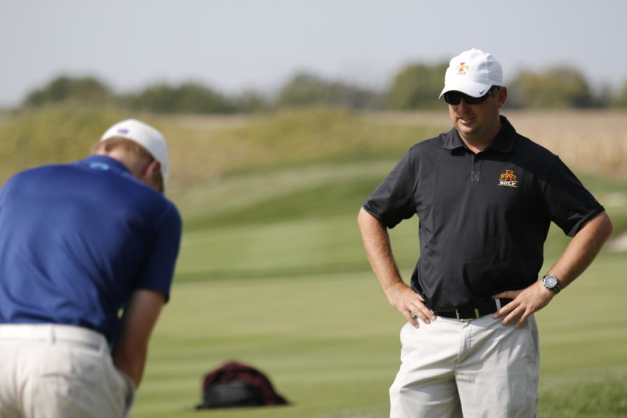 Iowa State men’s golf assistant coach Chad Keohane watches over the team as they practice at ISU’s golf performance facility south of campus. With a 7:2 player to coach ratio, ISU mens golfers are able to receive individual instruction as needed