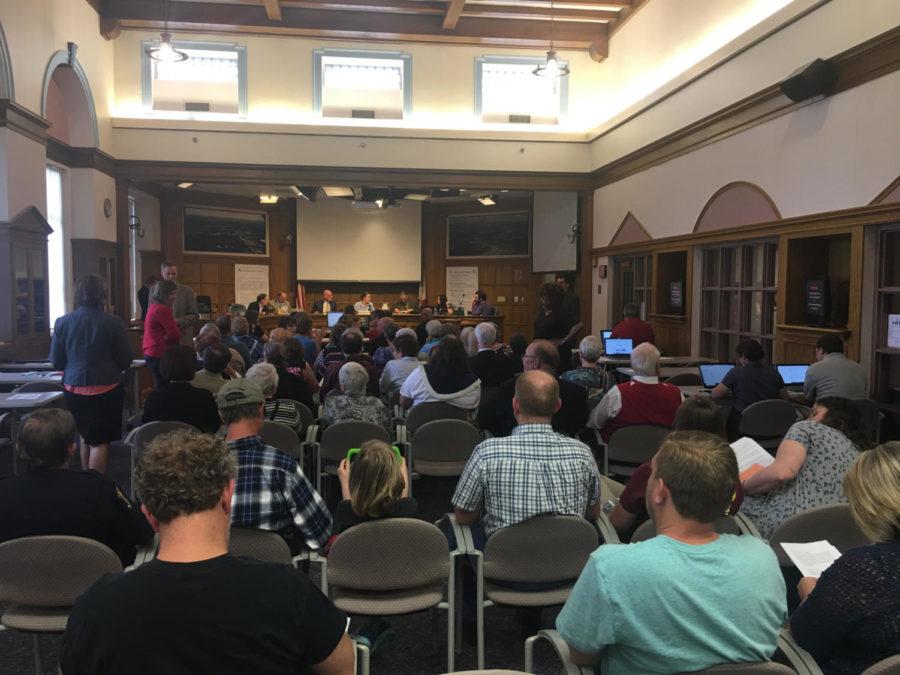 Ames community members meeting in the city council chambers May 8.