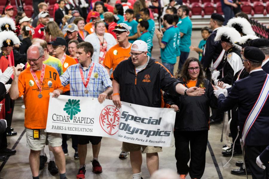 Athletes competing in this 50th year of the Iowa Secial Olympics walk into Hilton Coliseum during the opening ceremony May 17. This is the 34th time Ames has hosted the Iowa Special Olympics.