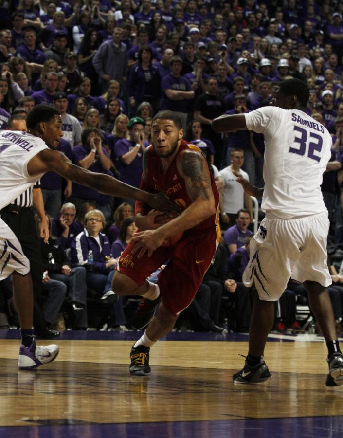 ISU forward Royce White tries to drive the ball past two Kansas State defenders during the first half of Iowa States 65-61 win over the Wildcats on Saturday, Feb. 25. The win was Iowa States 21st on the season.
