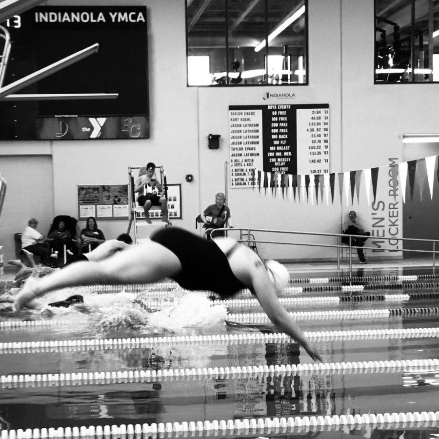 Marykate Dorrlacombe dives into a pool. Dorrlacombe will compete in the Special Olympics in Ames on May 18 and the National Special Olympics in Seattle in July.