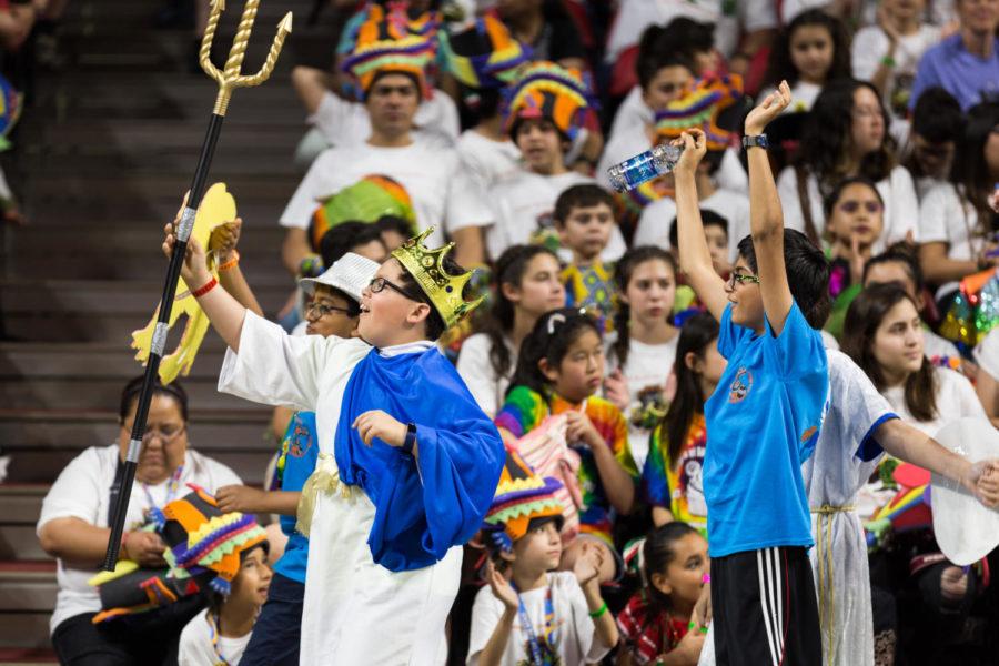 Odyssey of the Mind Participants walk in the Float and Banner Parade May 24 in Hilton coliseum. 