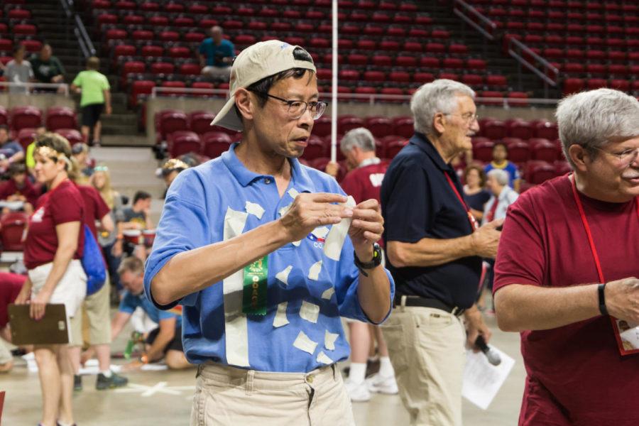 Coaches compete after the Graduation Ceremony on May 25. The competition consisted of trying to make the tallest structure an allotted materials.