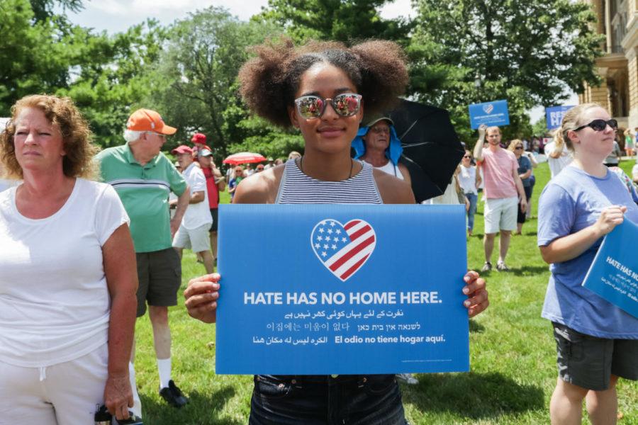 Isabel Ingram holds a sign reading hate has no home here at the Families Belong Together rally in Des Moines in front of the Capital Building June 30. 