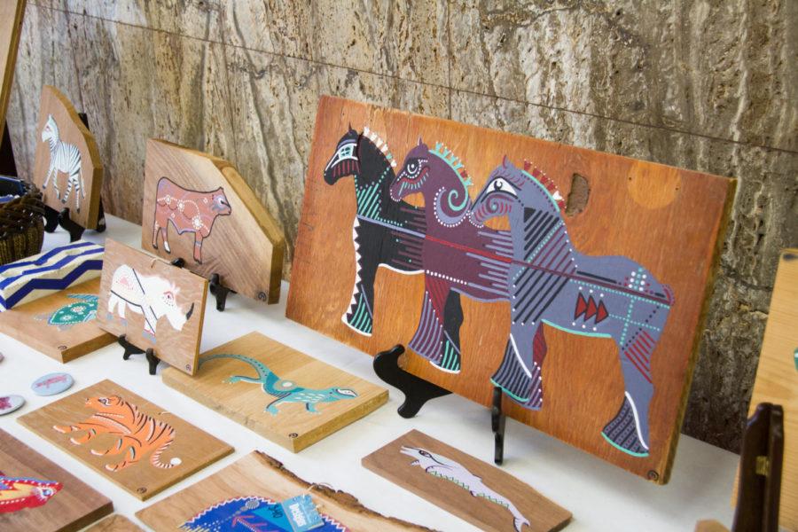Paintings of various animals are displayed during the Art Mart, Dec. 1 in the Memorial Union. At the mart, students and community members could purchase pieces of art made by Workspace students and instructors ranging from photography to hand blown glass. 
