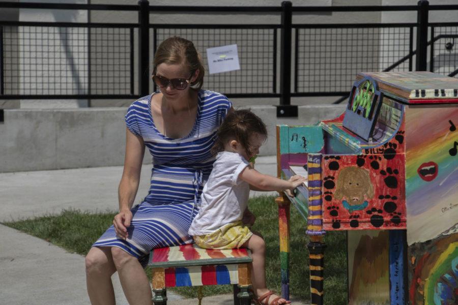 Community members gather in downtown Ames on June 30 to enjoy the famers market and live music.