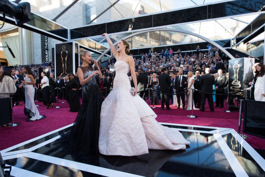 Jennifer Lawrence (R), Oscar®-nominee for Actress in a Leading Role, interviews with Kristin Chenoweth (L) upon her arrival for The Oscars® at the Dolby® Theatre in Hollywood, CA February 24, 2013.
