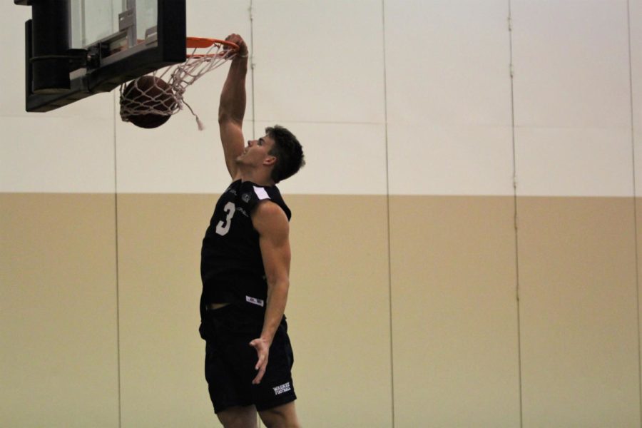 Michael Jacobson dunked the ball with one hand in a Capital City League game on July 9.
