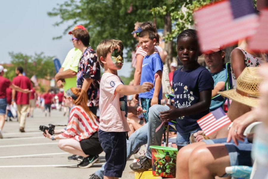 Kids+line+up+on+the+street+waiting+to+grab+some+candy+during+the+Fourth+of+July+Parade+in+Downtown+Ames.