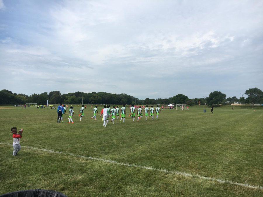 An adult soccer team warming up before their game during the Summer Iowa Games at Hunziker Youth Sports Complex in Ames.