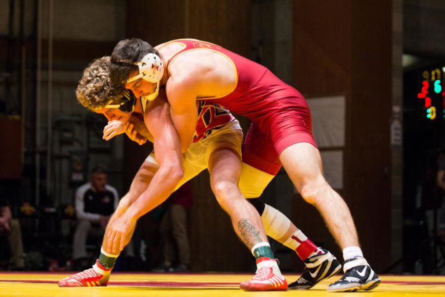 Redshirt sophomore Hank Swalla wrestles Dean Sherry Nov. 26 in Stephens Auditorium during the Iowa State vs Rider wrestling meet. The Cyclones were defeated 15-22. 