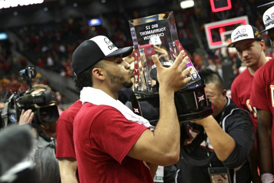 Naz Mitrou-Long kisses the Big 12 Championship trophy following the Cyclones 80-74 win over West Virginia in the tournament championship at the Sprint Center in Kansas City, Missouri.