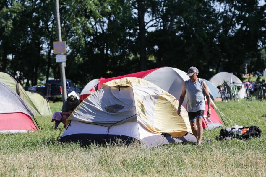 RAGBRAI participant sets up his tent in a campground located across from Hilton Coliseum in 2018.