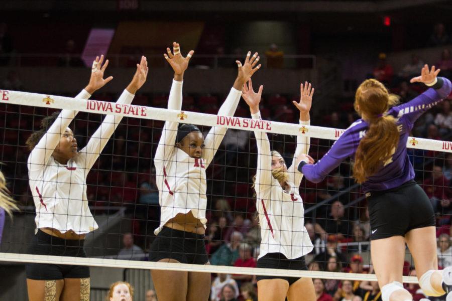 Members of the ISU volleyball team go up for a block during the first set of the Kansas State Volleyball Match. Iowa State Defeated K-State in three consecutive sets.