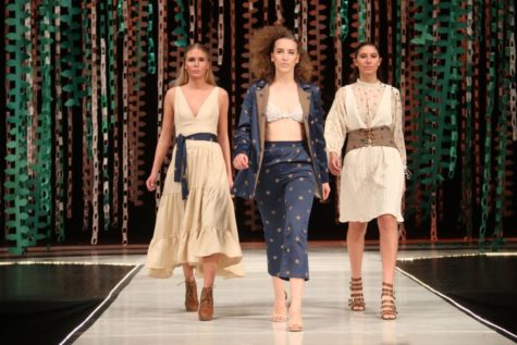Models walk down the runway showcasing student designs at Iowa States 2018 Fashion Show.
