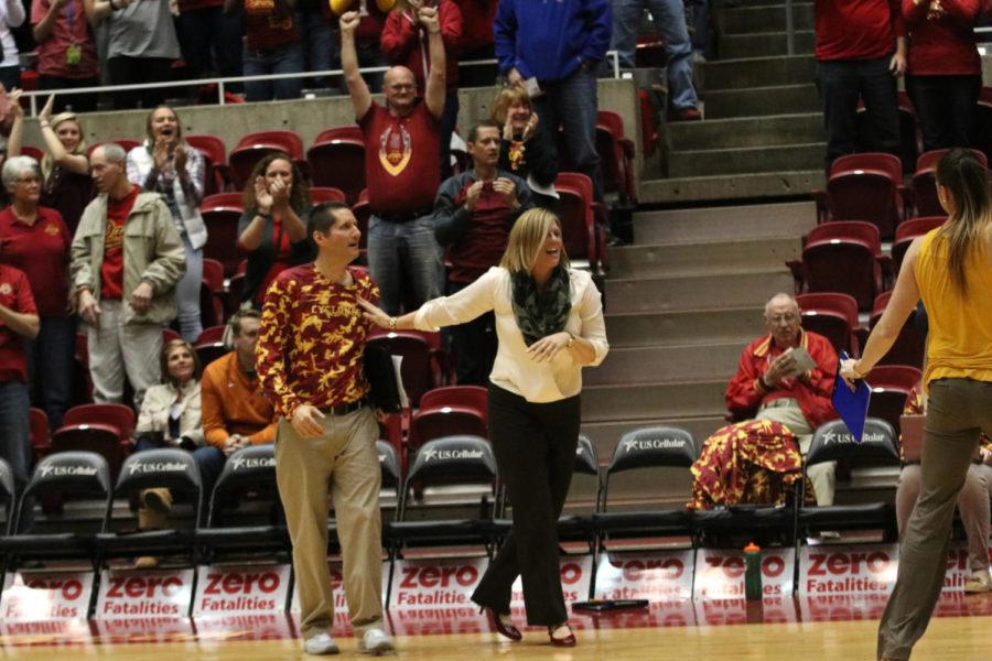 Head Coach Christy Johnson-Lynch and Assistant Coach Joe Lynch celebrate as the Cyclones score the final point. Iowa State beat the Texas Longhorns 3-2 on Nov. 12.
